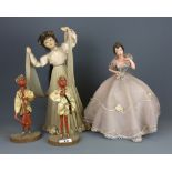 A tin and celluloid musical battery operated dancing girl, together with a 1930's lady light and two