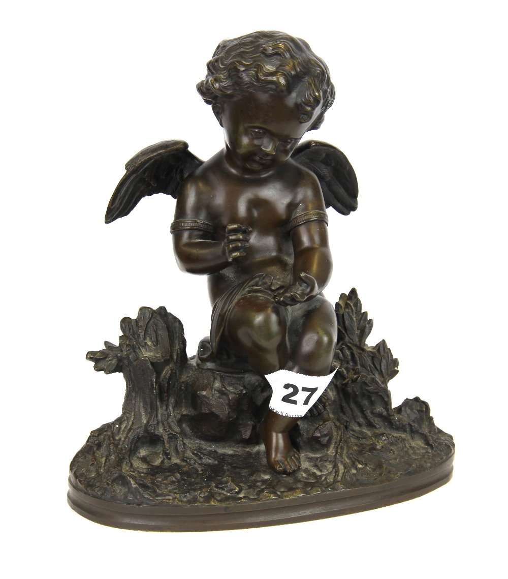 A 19th Century bronze figure of a cherub, H. 21cm.