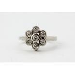 A 14ct white gold diamond set cluster ring, approx. 0.70ct overall, (N).