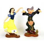 Two boxed porcelain figures from The Classics of Walt Disney collection - Snow White and The Seven