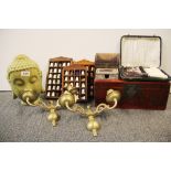 A pair of brass wall sconces, a ceramic Buddha head and other items.
