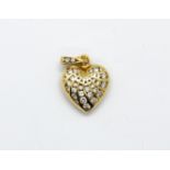An 18ct yellow gold diamond set heart shaped pendant with a pearl fitting bail, L. 2.5cm.