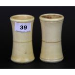 A pair of early 20th Century turned ivory dice shakers, H. 10cm.