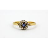 An 18ct yellow gold sapphire and rose cut diamond set cluster ring, (M).