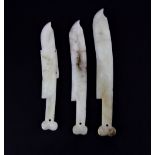 A group of three white jade blades used for skin cleaning in early Chinese steam baths, longest L.