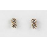 A pair of 9ct yellow gold stone set earrings, L. 0.7cm.
