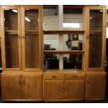 An Ercol three section glazed bookcase and display cabinet, overall W. 230cm H. 210cm.