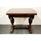 A 1930's oak draw leaf dining table with bulbous pedestal legs, 94 x 91cm, extending to 154cm.