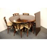 A small 1920's oval mahogany dining table with ball and claw feet, W. 131cm extending to 186cm,