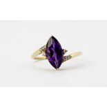 A 9ct yellow gold ring set with a large marquise cut amethysts and diamonds, (S).