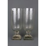 A pair of Edwardian style cut glass storm lanterns, H. 40cm.