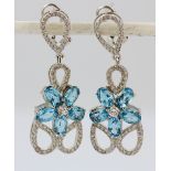 A pair of 925 silver drop earrings set with oval cut topaz and white stones, L. 4cm.