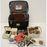 A case of mixed costume jewellery and other items including a 1921 US one dollar coin and a 1933 Du