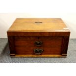 An oak cased cutlery box and contents, 48 x 33 x 25cm.