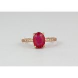 A 925 silver rose gold gilt oval cut ruby and white stone set ring, (P).