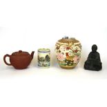 A Chinese Yixing terracotta teapot, together with three other items.