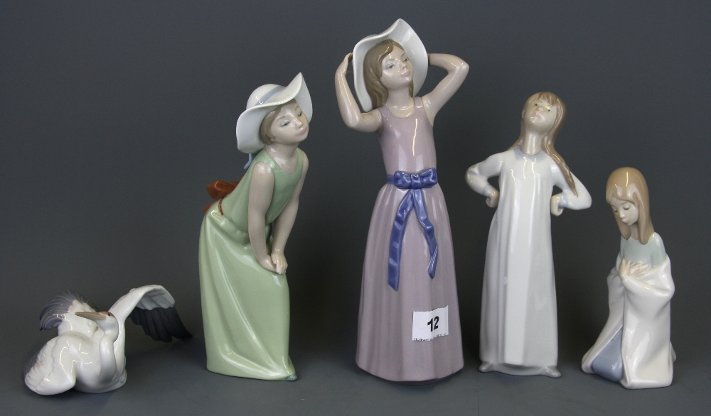 Five Lladro porcelain figures, tallest H. 25cm.