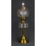 An Edwardian brass and glass oil lamp with frosted shade, H. 62cm.