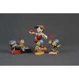 A group of four Disney Classics collection figurines of Pinocchio 'Goodbye Father' and three others,