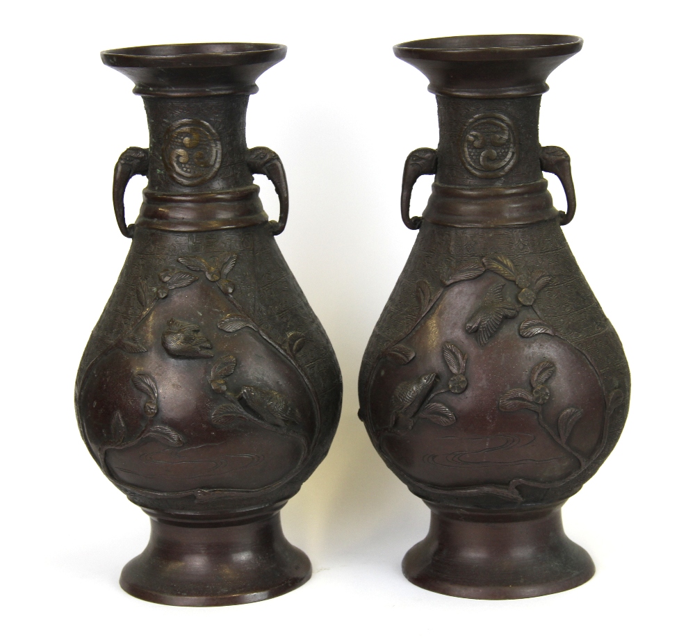 A pair of Japanese bronze vases decorated with panels of birds and with elephant head handles, H. - Image 2 of 2