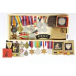 A small group of WWII medals, badges, etc. together with two WWI service medals.