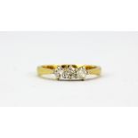 An 18ct yellow gold ring set with three brilliant cut diamonds, approx. 0.60ct, (O.5).