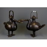 A superb pair of Chinese bronze goose shaped wine ewers, H. 34cm L. 39cm.