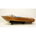 A wooden model power boat, L. 87cm.