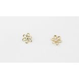 A pair of 14ct yellow gold flower shaped stud earrings, Dia. 0.6cm.