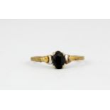A 9ct yellow gold sapphire set ring, (L.5).