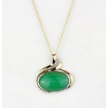 A yellow and white metal (tested 18ct gold) pendant set with cabochon cut jade and diamonds on a 9ct