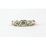 A white metal (tested 18ct gold) ring set with five brilliant cut diamonds, approx. 2.55ct,