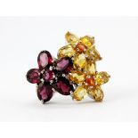 A 925 silver citrine and garnet set flower shaped ring, (N).