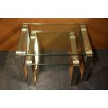 A nest of two heavy plate glass and stainless steel coffee tables, largest 95 x 65 x 39cm