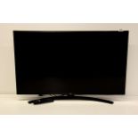 LG smart TV HD flatscreen 43" with built-in Wi-Fi and remote control.