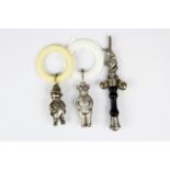 A silver plate mounted Mr Punch babies whistle/rattle together with two further silver plated