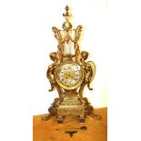 An impressive French gilt brass classical mantle clock with enamelled porcelain numerals, c.1900, H.