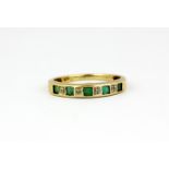A 9ct yellow gold emerald and diamond set ring, (P).