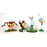 Two Coalport porcelain figures of Looney Tune characters playing golf and a further Wedgwood