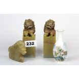 A pair of Chinese carved soapstone lion dog figures together with a carved soapstone dragon and a