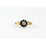 A 9ct yellow gold sapphire and diamond set cluster ring, (O.5).