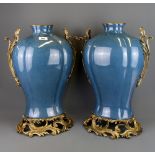 A pair of large continental ormolu mounted crackle glazed porcelain vases, H. 49.5cm.