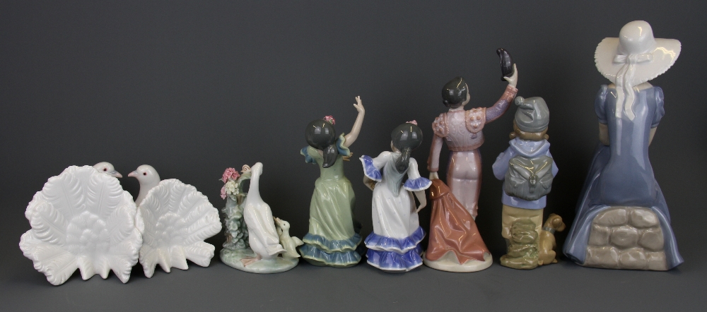 Five Lladro figurines and two Nao figurines, tallest H. 27cm. - Image 2 of 3