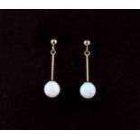 A pair of 9ct yellow gold opal set drop earrings, L. 2.5cm.