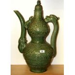 A large Chinese Ming dynasty style crackle celadon glazed wine ewer with dragon handle, H. 62cm.