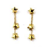 A pair of 9ct yellow gold star shaped drop earrings, L. 3.5cm.