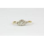 An 18ct yellow gold and platinum diamond set ring, (N).