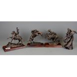 Four bronze Indian and Cowboy figurines issued by The Frederick Remington Art Museum, tallest H.