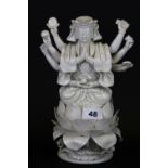 An early 20thC Sino / Tibetan blanc de chine porcelain figure of a multi-armed deity.