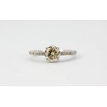 An 18ct white gold (stamped 18k) solitaire ring set with a brilliant cut 1.26ct diamond and